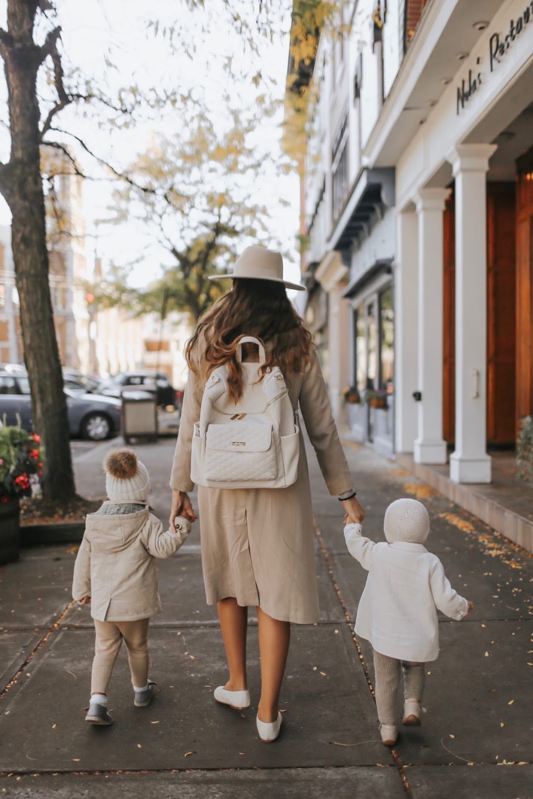 mom with kids and carrying luli bebe diaper bag backpack