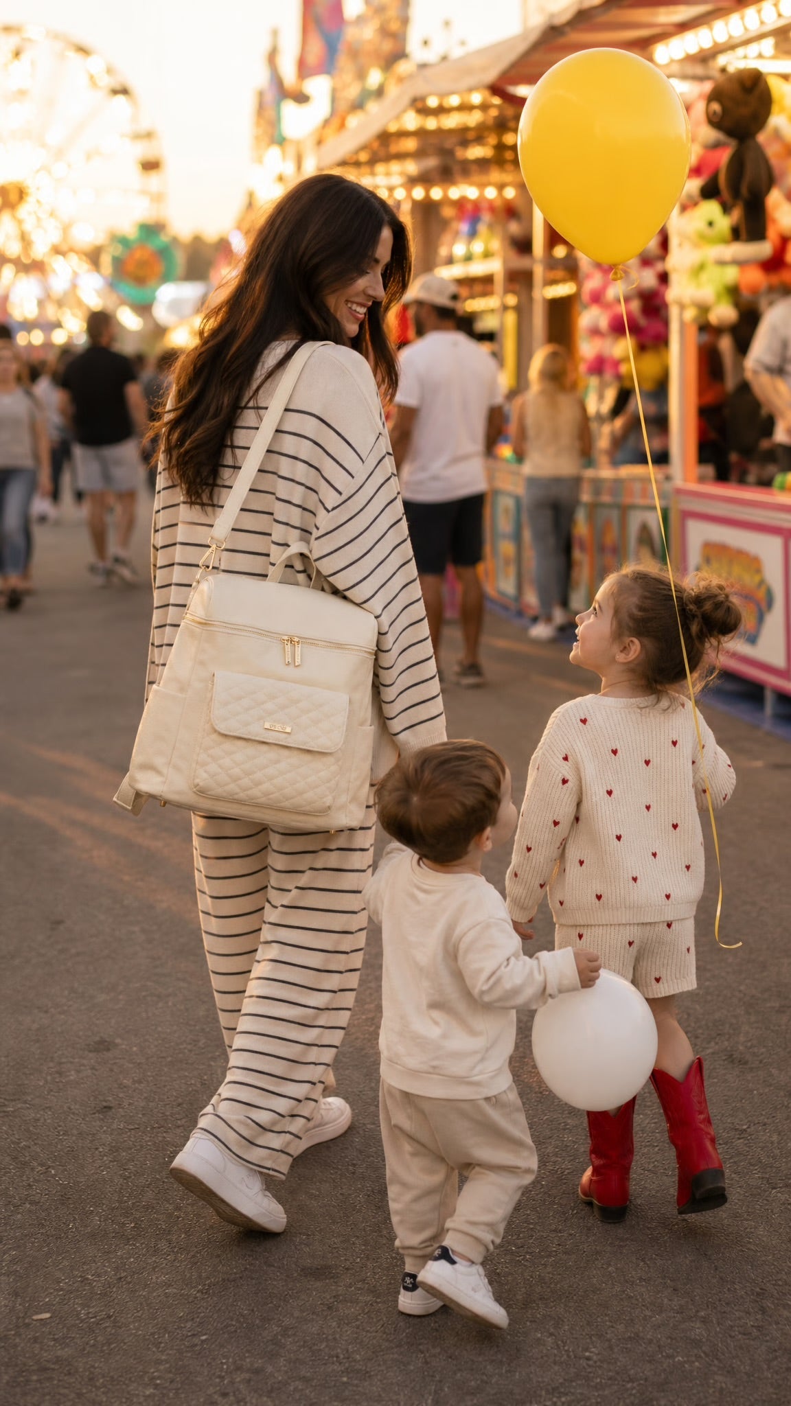 Out with kids, mom with diaper bag backpack