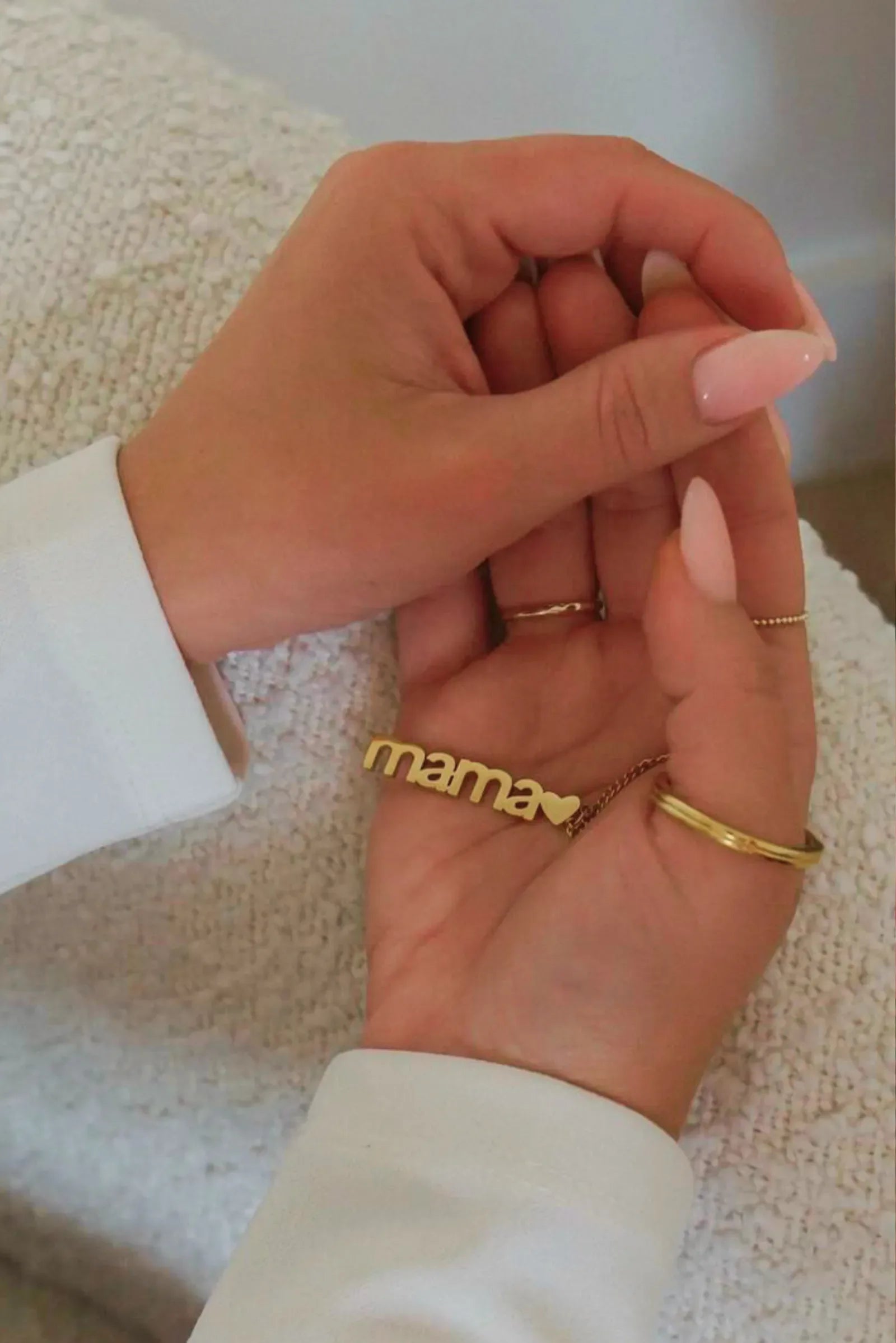 Woman holding Mama charm keychain in hand – gold plated gift for moms