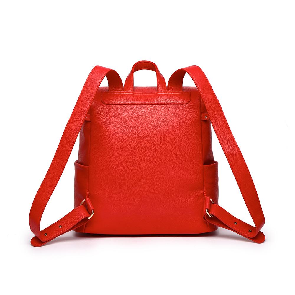 Imperfect Luli Bebé Monaco red vegan leather diaper bag backpack with quilted front pocket and gold hardware.