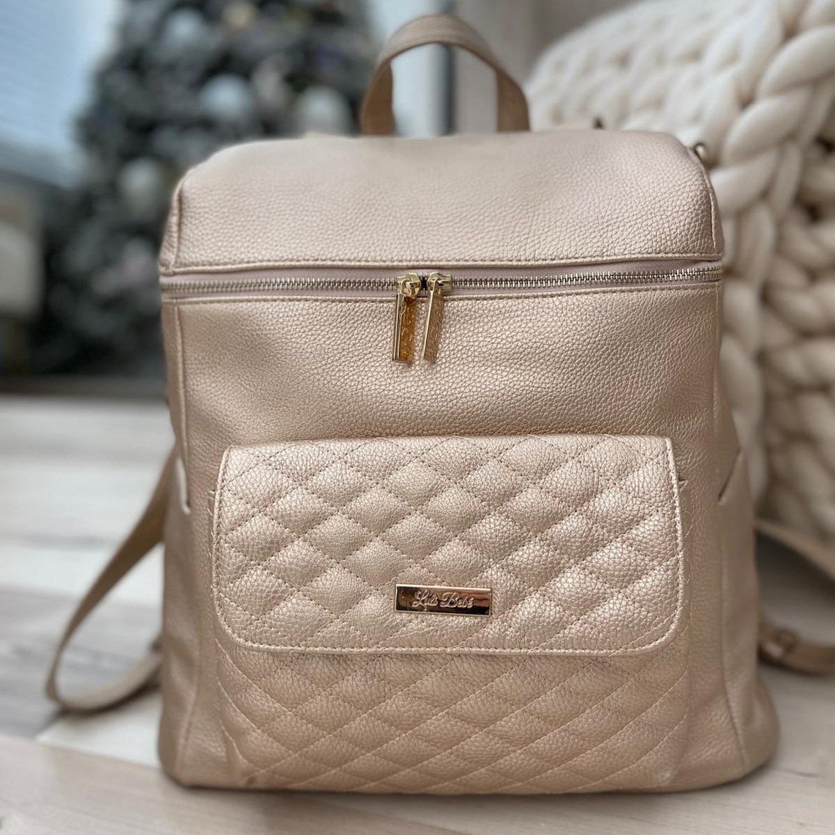 Imperfect Luli Bebé Monaco gold vegan leather diaper bag backpack with quilted front pocket and gold hardware