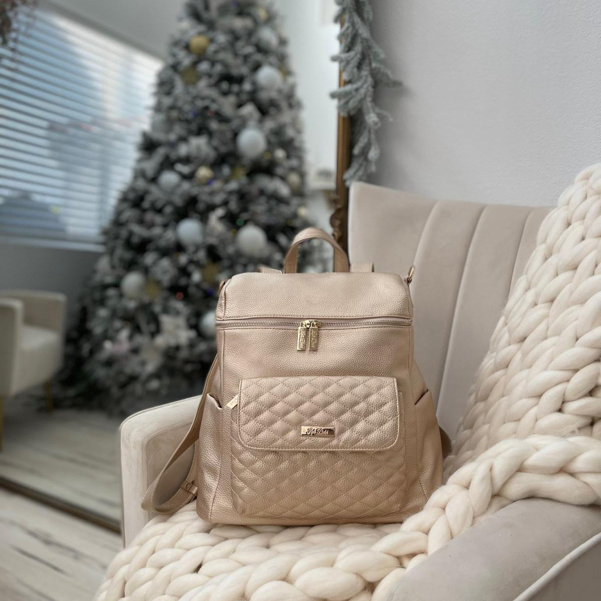 Imperfect Luli Bebé Monaco gold vegan leather diaper bag backpack with quilted front pocket and gold hardware