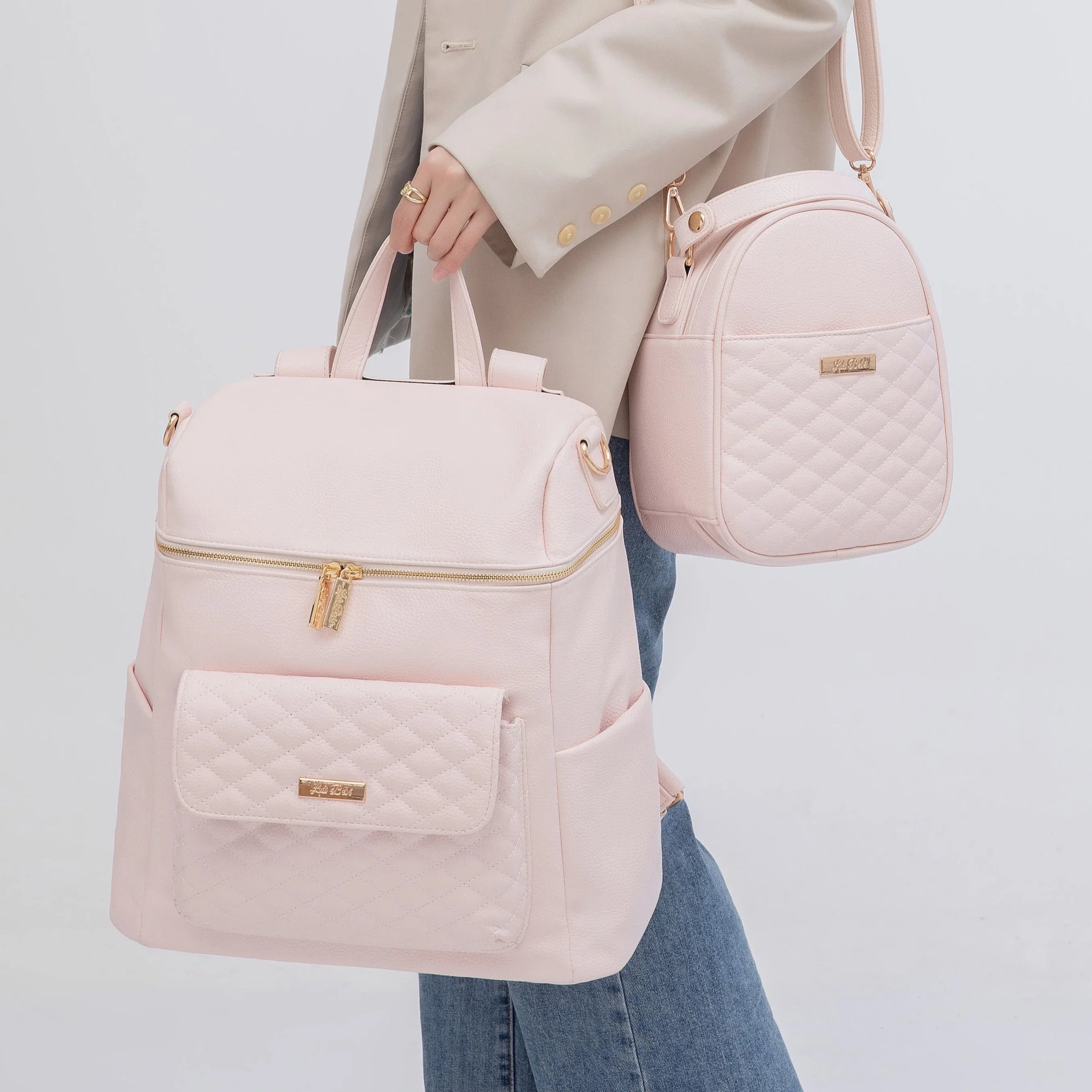 Stylish pink diaper bag with matching snack bag by Luli Bebe, perfect for moms on the go with baby essentials