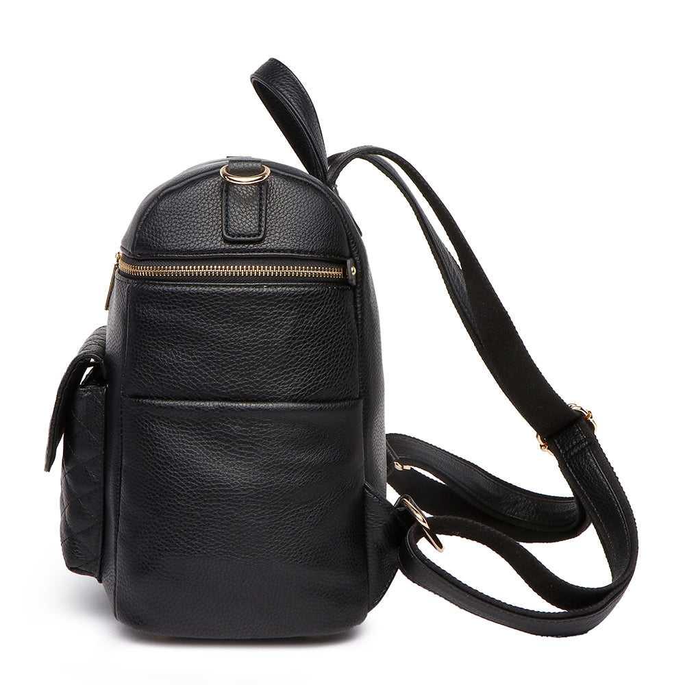 Petit Monaco ebony black diaper bag by Luli Bebe, side view showing stroller straps and sleek pockets for baby bottles and everyday essentials