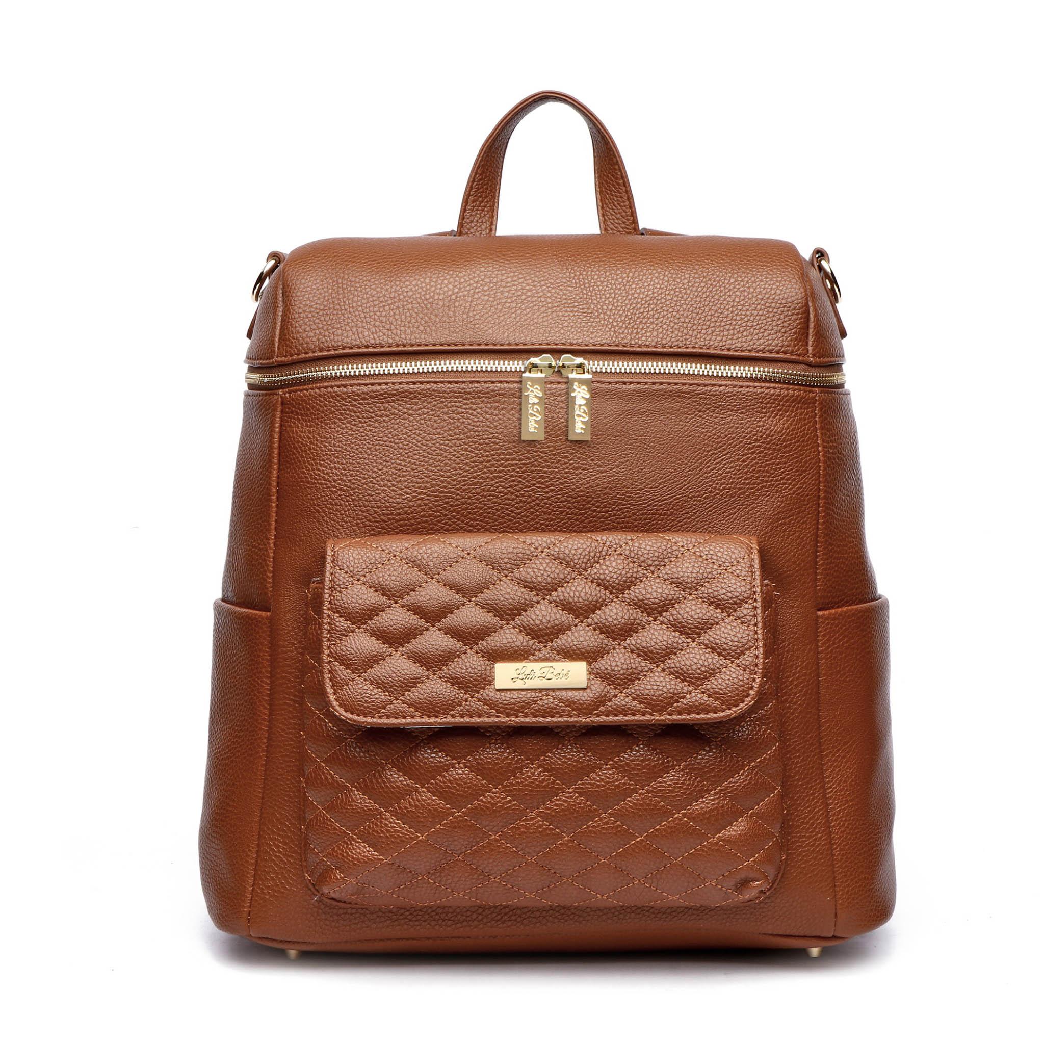Caramel brown signature Monaco diaper bag backpack with quilted front pocket, gold hardware and adjustable straps on white background