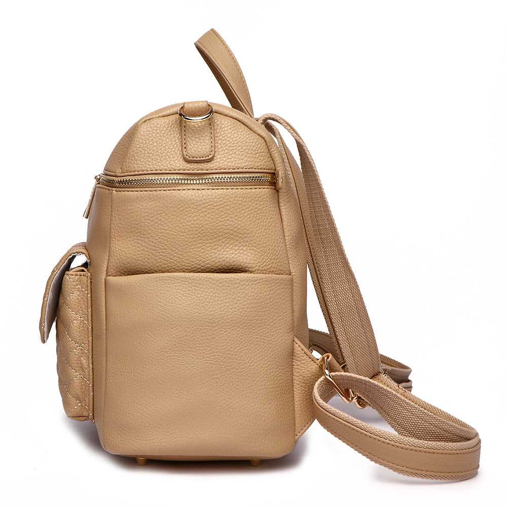 Latte brown mini diaper bag side view showing crossbody strap and compact design in premium vegan leather