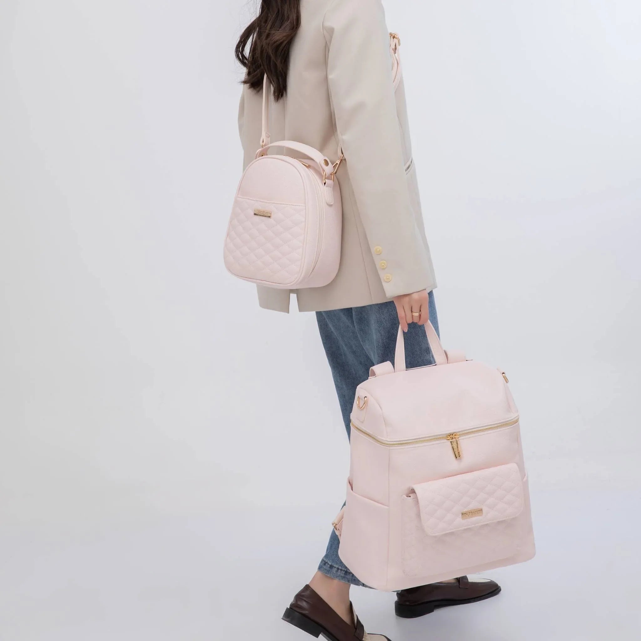 Pink diaper bag and snack bag in use – Luli Bebe Monaco collection, luxury vegan leather matching set for stylish moms and everyday baby duties