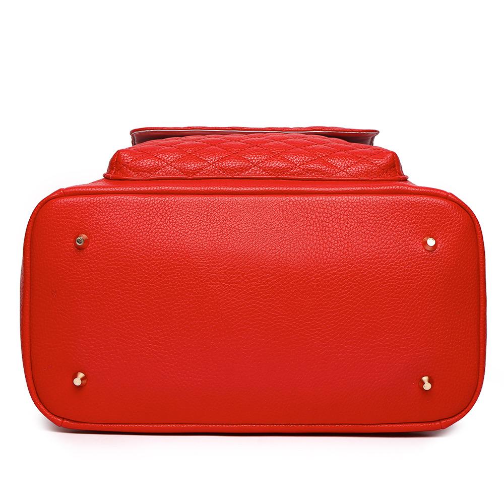 Imperfect Luli Bebé Monaco red vegan leather diaper bag backpack with quilted front pocket and gold hardware.