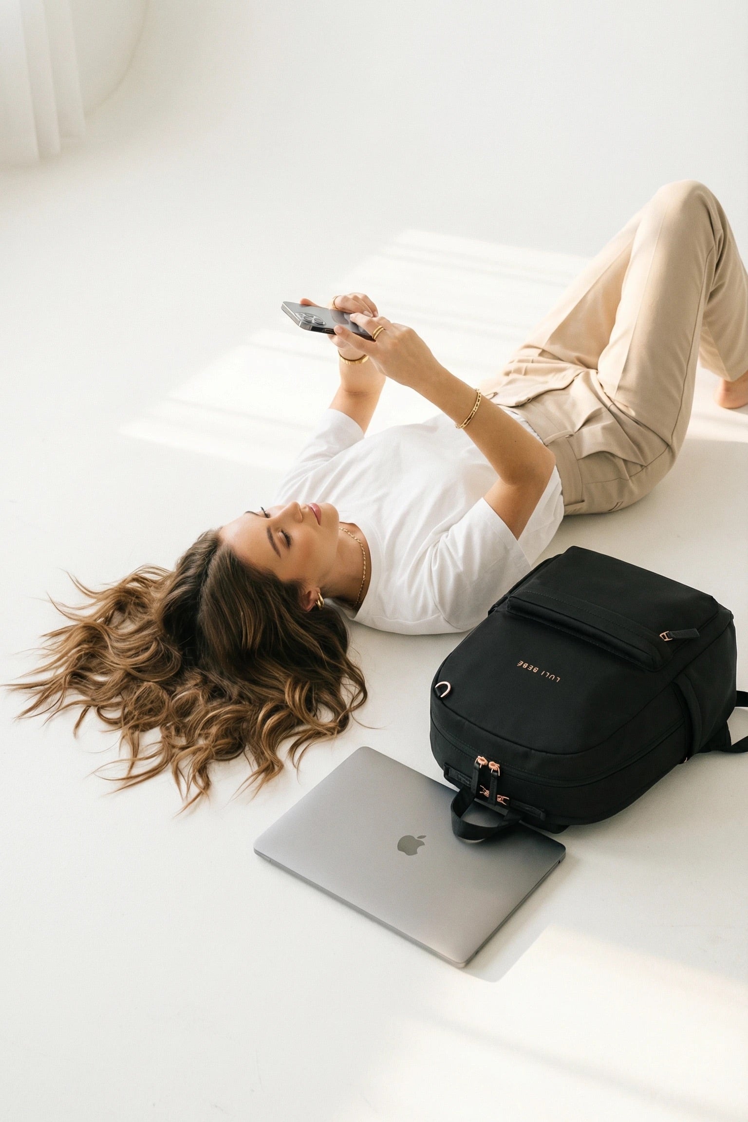Black The Daily Backpack Luli Bebe in a clean lifestyle setting