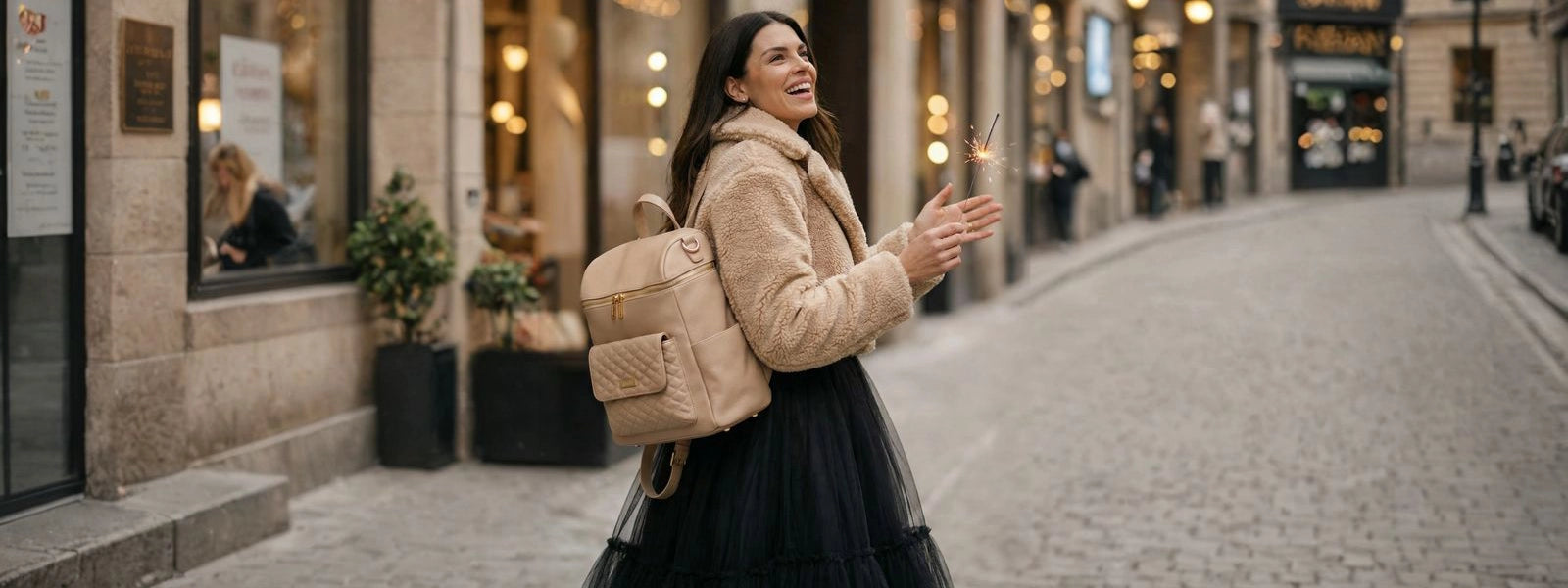 mom showing designer diaper bag 